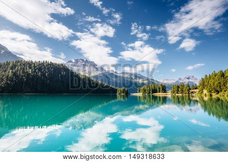 Great view of the azure pond Champfer in alpine valley. Popular tourist attraction. Picturesque and gorgeous scene. Location Swiss alps, Silvaplana village, district of Maloja, Europe. Beauty world.