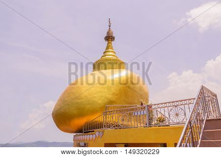 The replica of Phra That In-Kwaen (Hanging Golden Rock) at Koh (islands) Sirey temple Phuket Thailand. It was built by Myanmar Buddhists who works in this region