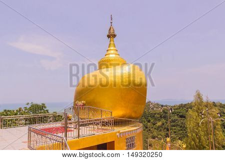 The replica of Phra That In-Kwaen (Hanging Golden Rock) at Koh (islands) Sirey temple Phuket Thailand. It was built by Myanmar Buddhists who works in this region