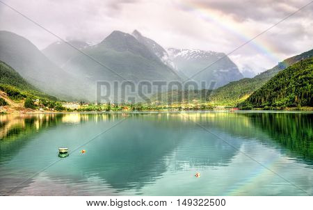 Rainbow above Nordfjorden fjord near Loen in Norway