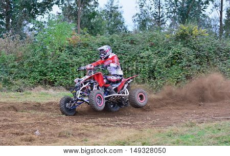 Unidentified Racer Rides A Quad Motorbike.