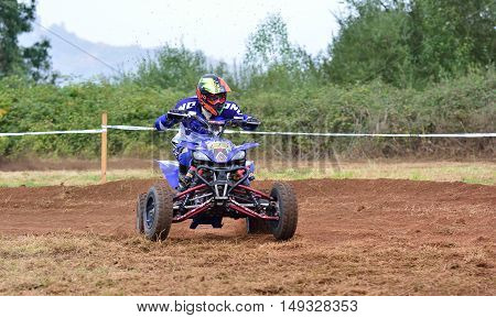 Unidentified Racer Rides A Quad Motorbike.
