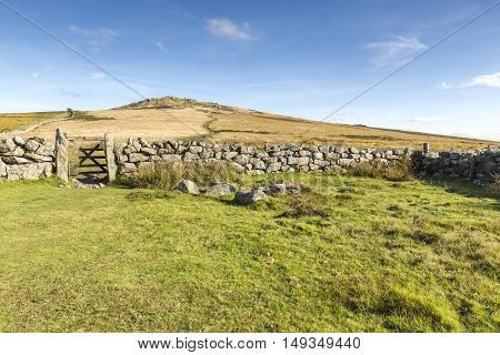 An image capturing a gateway and path up to Rippon Tor, Dartmoor, Devon, England, UK.