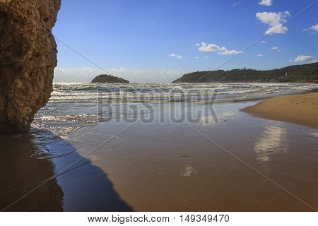 Summertime.Gargano coast: Portonuovo beach,Vieste-(Apulia) ITALY-In the background the Gattarella island.