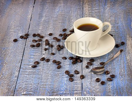 Morning coffee. A cup of coffee on the old wooden background. Christmas. Aromas holiday. The mood is festive night.Warmth and comfort in the cold winter.Close-up. / selected focus/