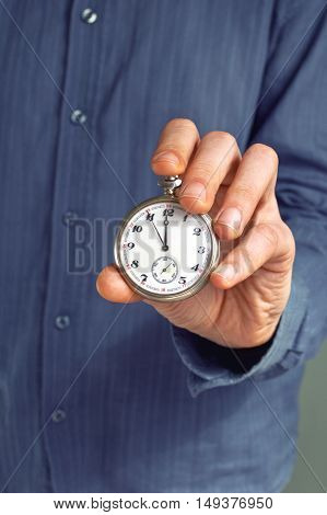 Old pocket watches in hand. Time contept.