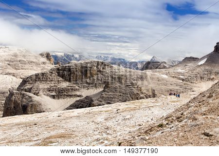 People hiking in Sass Pordoi Dolomites Italy Europe