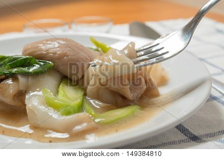 Rad Na, Famous Thai Chinese Style Wide Rice Noodle Dish With Tasty Tender Pork With Thick Gravy Sauc