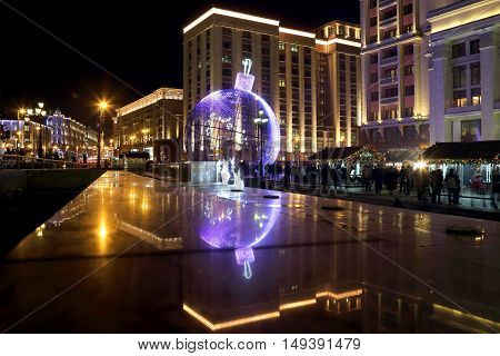 huge Christmas ball at the colored lights in the center of Moscow. Russia