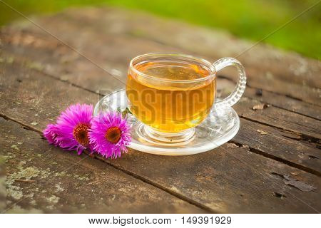 Chinese green tea in a beautiful bowl with flowers