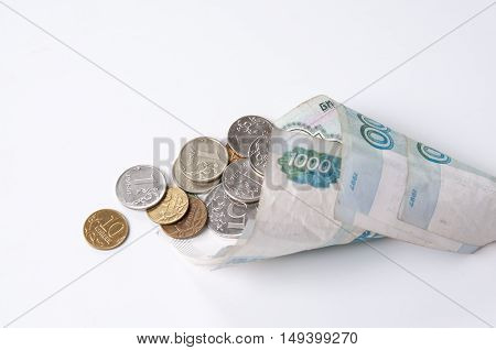 Coins in denominations folded sack top view