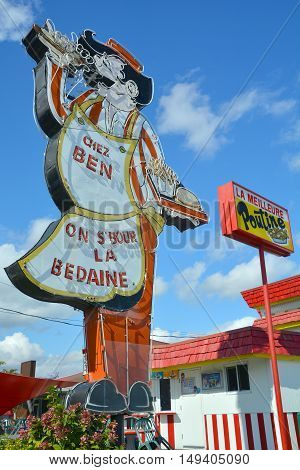 GRANBY QUEBEC CANADA 09 28 2016: Sign of Cantine Ben La Bedaine fast food restaurant some of the best Quebecois comfort food available.
