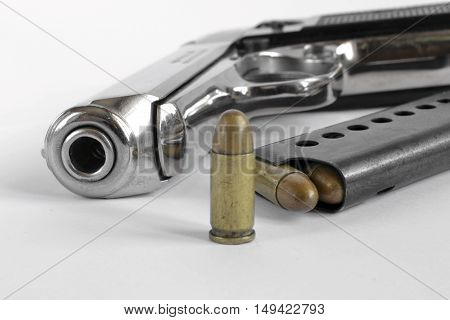 Pistol and ammunition on the white background.