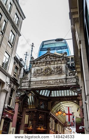 LONDON UK - AUGUST 21 2015: Street in the city of London with the contrast between historical buildings and new skyscrapers at Leadenhall Market