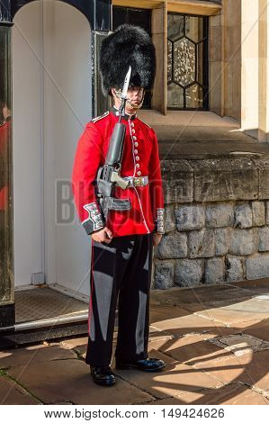 LONDON UK - AUGUST 21 2015: Queen's Guard - Tower of London. The Queen's Guard is the contingents of infantry and cavalry soldiers charged with guarding the official royal residences in the United Kingdom.