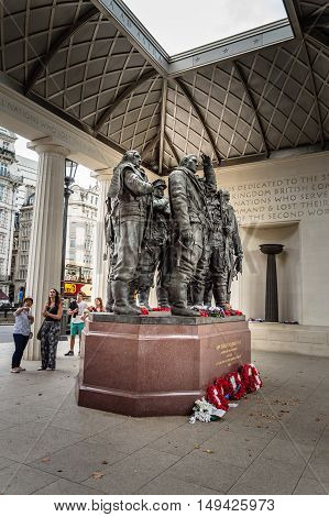 London UK - August 19 2015: People at The Bomber Command Memorial commemorates the 55573 who died while serving in the Bomber Command during the Second World War.