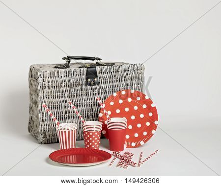 Red disposable tableware for parties and picnics. Selective focus.