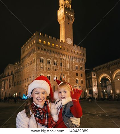 Mother And Daughter In Christmas Hats In Florence Handwaving