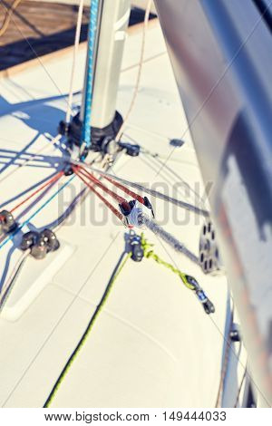 A boom vang or kicking strap is a line or piston system on a sailboat used to exert downward force on the boom and thus control the shape of the sail.