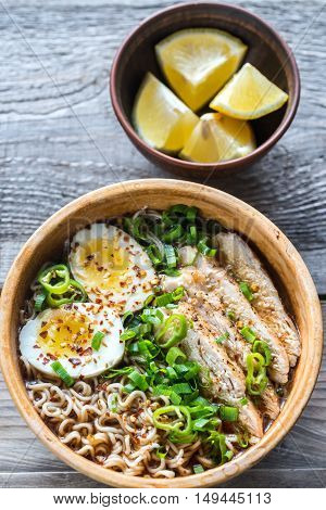 Bowl Of Chicken Ramen Soup On The Wooden Table