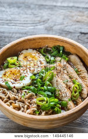 Bowl Of Chicken Ramen Soup On The Wooden Table