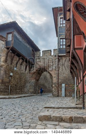 Night photo of old houes and ancient fortress entrance of old town of city of Plovdiv, Bulgaria