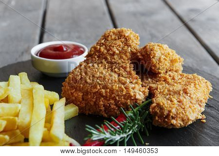 Breaded crispy chicken wing fried french fries sauce