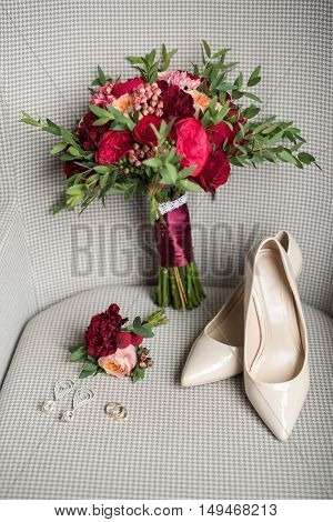 wedding details of a ring shoe bouquet