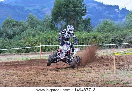 Unidentified Racer Rides A Quad Motorbike.