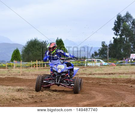 Unidentified Racer Rides A Quad Motorbike.