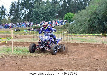 Unidentified Racer Rides A Quad Motorbike.