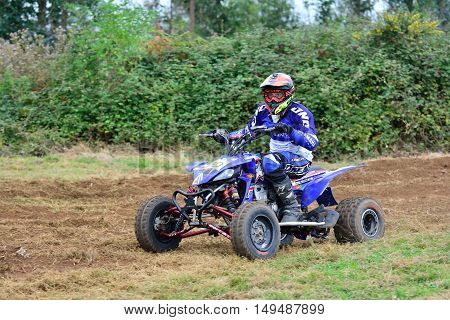 Unidentified Racer Rides A Quad Motorbike.