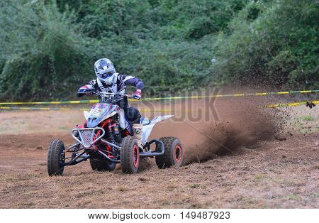 Unidentified Racer Rides A Quad Motorbike.