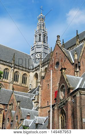 Haarlem, The Netherlands - June 5, 2014. Tower of Grote Kerk van St Bavo in Haarlem, with other architectural details of the building.