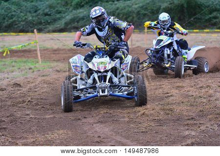 Unidentified Racer Rides A Quad Motorbike.