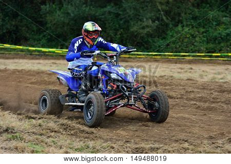 Unidentified Racer Rides A Quad Motorbike.