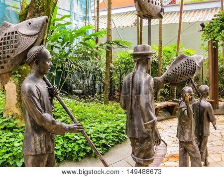 SINGAPORE, REPUBLIC OF SINGAPORE - JANUARY 09, 2014: Sculptures of Chinese processions in the Telok Ayer area, Singapore