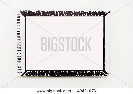 Simple plain background Opened empty notebook page banner with black marker painted abstract frame isolated on white table  Copyspace for text advertising quote Planning concept idea action plan creation