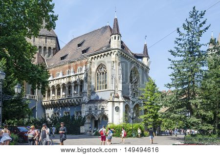 BUDAPEST, AUGUST 9: Tourists enjoying the beautiful weather visit Vajdahunjad Castle on August 9, 2015 in Budapest, Hungary. Vajdahunyad Castle is located in the City Park.