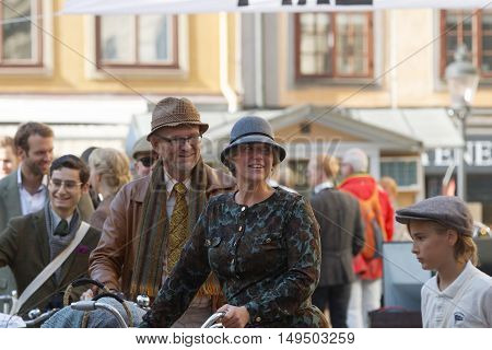 STOCKHOLM - SEPT 24 2016: Many people in old fashioned clothes in a queue in the Bike in Tweed event September 24 2016 in Stockholm Sweden