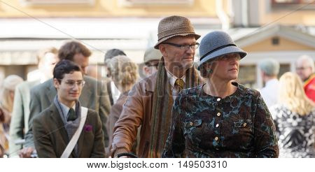 STOCKHOLM - SEPT 24 2016: Many people in old fashioned clothes in a queue in the Bike in Tweed event September 24 2016 in Stockholm Sweden
