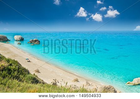 Megali Petra Beach, Lefkada Island, Greece. A beautiful beach with large rocks in the water.