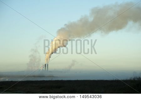 The Proserpine sugar mill Queensland Australia belching steam into the air from its chimneys