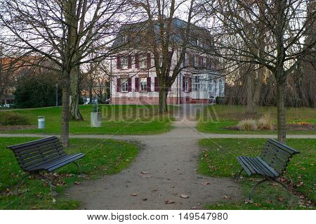a metal benches and villa in a park of Brombach park Germany
