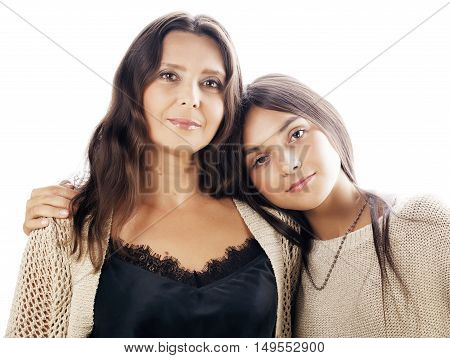 cute pretty teen daughter with mature mother hugging, smiling, fashion style brunette makeup close up tan s, isolated on white background, lifestyle people concept
