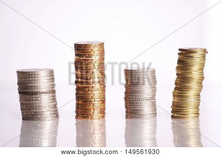 Gold and silver coins isolated on white background