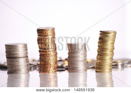 Gold and silver coins isolated on white background