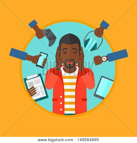 An african-american young man in despair surrounded by many hands with gadgets around him. Man using many electronic gadgets. Vector flat design illustration in the circle isolated on background.