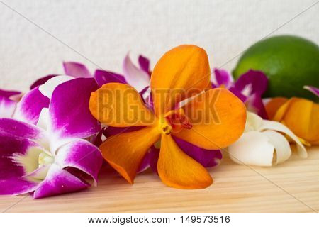 tropical flower on wood table . .
