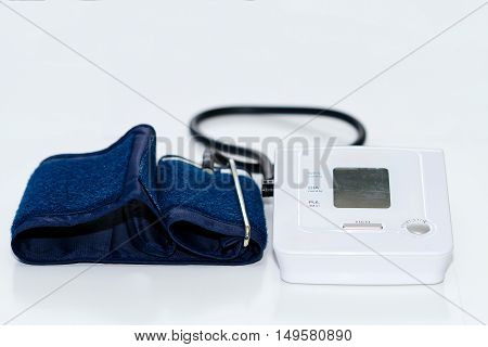 Automatic digital blood pressure monitoring meter on white background